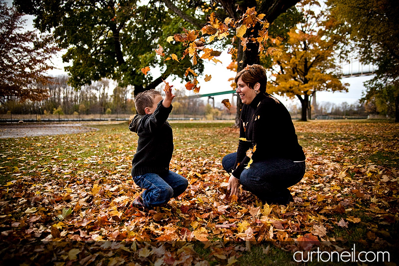 Assignack Family - playing in leaves